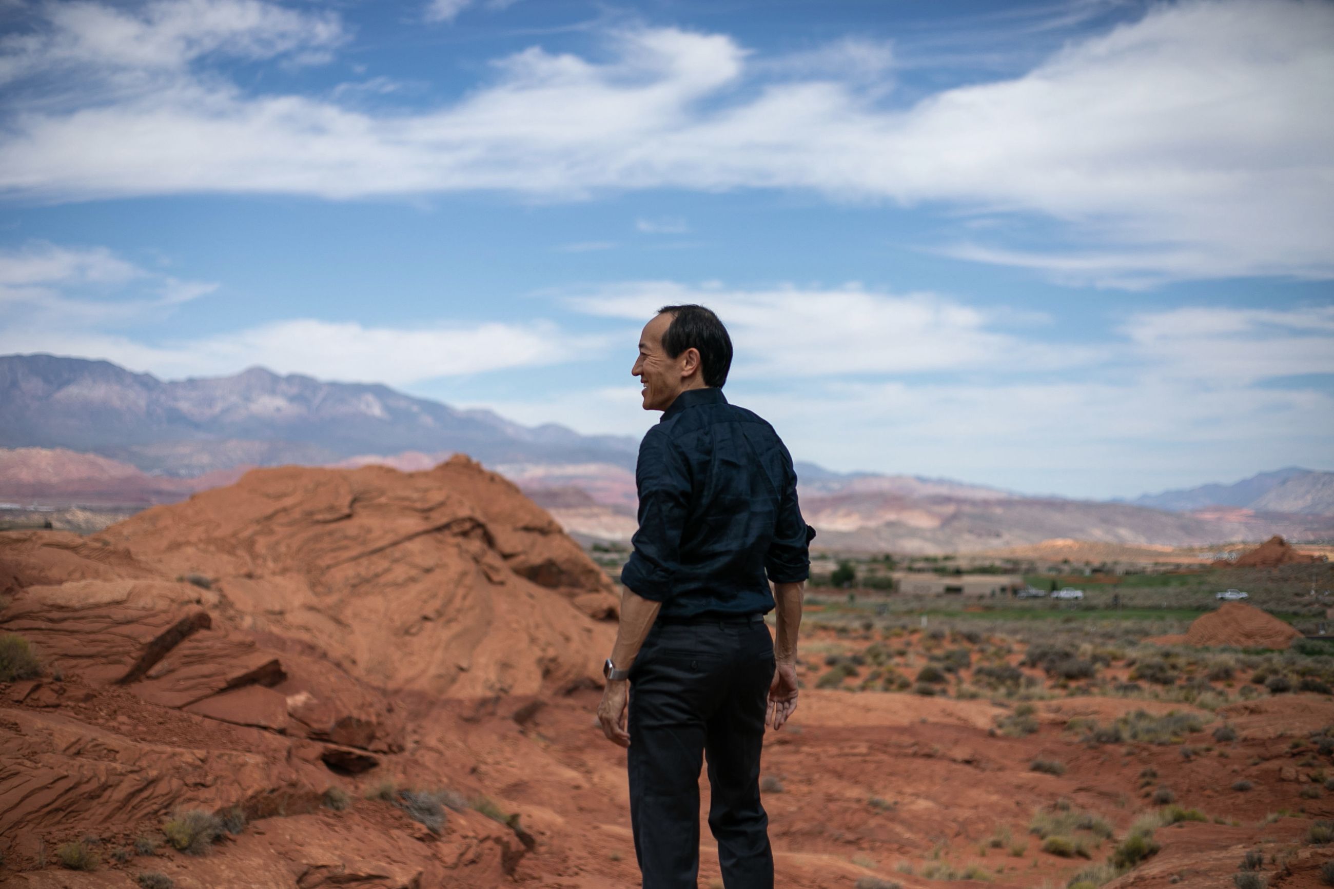Nikky Kho looking out across a red-rock desert landscape